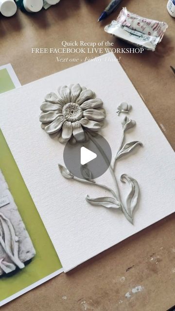 an image of a paper flower being made