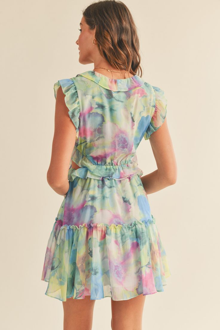 Description Description and Fit - Printed- Mini dress- Cut out on the sides- Ruffle detailing - V neck - Tiered - Floral pattern design- Regular fit- Ruffle shoulders- Multi color fabric Model Measurements - Model is wearing a size Small Fabric 100% Polyester Style #JD2050G Multicolor Floral Dress With Flutter Sleeves And Ruffles, Multicolor Floral Dress With Ruffles And Flutter Sleeves, Vacation Floral Dress With Flutter Sleeves And Ruffles, Multicolor Summer Dress With Ruffle Sleeves, Multicolor Ruffle Sleeve Summer Dress, Multicolor Flutter Sleeve Dress With Ruffle Hem, Summer Floral Dress With Ruffle Sleeves, Floral Ruffle Sleeve Dress For Vacation, Multicolor Flutter Sleeve Dresses For Spring