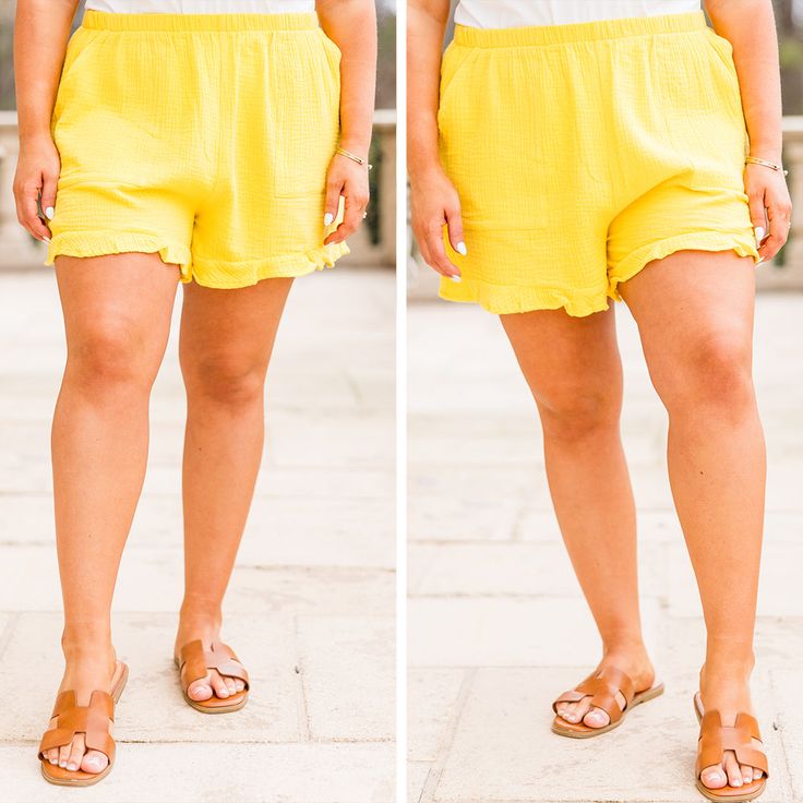 The shorts have us in a daze! The bold yellow color is so gorgeous and the crepe textured fabric is to die for! These have an elastic waist to keep you in comfort and a totally sweet ruffle hem! The pockets on the front are super convenient so just throw these on with your fave top and some super cute sandals for the perfect warm weather look! 100% Viscose Summer Ruffle Shorts For Beach Season, Summer Ruffled Shorts For Beach Season, Yellow Ruffled Bottoms For Vacation, Yellow Ruffled Beach Bottoms, Beach Season Ruffled Shorts, High-waisted Yellow Shorts For Beach, Ruffled Shorts For Beach Season, Ruffled Beach Season Shorts, Yellow Vacation Shorts With Elastic Waistband