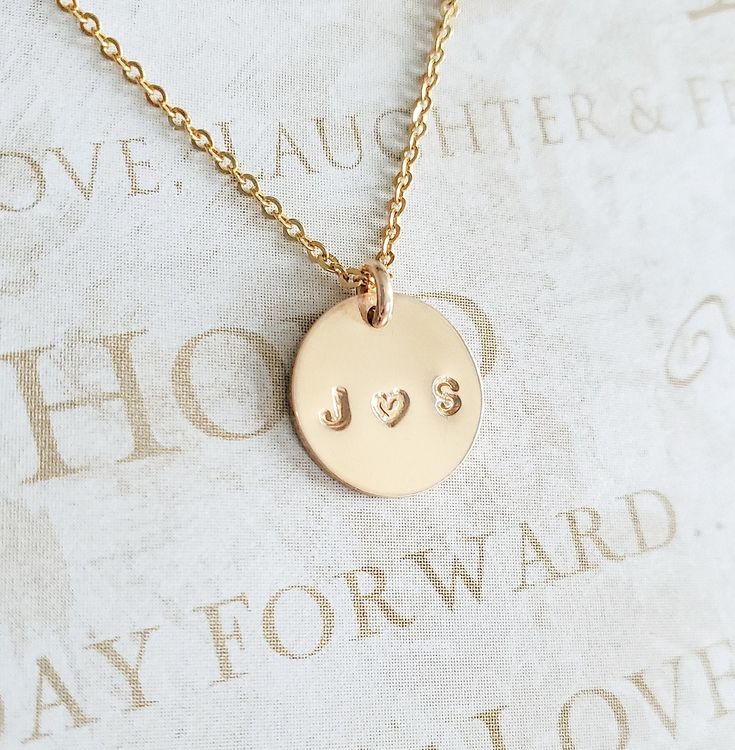 "Couples Initial Necklace - 14K Gold Filled - Mothers Gift - Name Necklace - Initial Necklace - Personalized Necklace - Gift for Her - 11mm * Dimensions: 11mm Diameter 14K Gold Filled Circle Disc Pendant * Necklace Chain Length: Available in 14in, 16in, or 18in ---------------------------------- HOW TO ORDER 1. Select the length that you would like from the drop down menu. * This item only comes in Font Type 3 (1.5mm)* This listing is for (1) necklace. Please feel free to let us know if you have Elegant 14k Gold Hand Stamped Necklaces, Elegant 14k Gold Necklace With Hand Stamped Details, Elegant 14k Gold Necklace Hand Stamped, Anniversary Jewelry With Round Disc Pendant, 14k Gold Hand-stamped Charm Necklace For Anniversary, Gold Nameplate Necklace For Wedding Gift, Gold Nameplate Jewelry For Wedding Gift, 14k Gold Charm Necklace For Anniversary, Gold Hand Stamped Round Pendant Jewelry