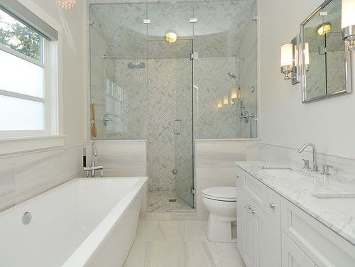 a white bathroom with two sinks and a bathtub