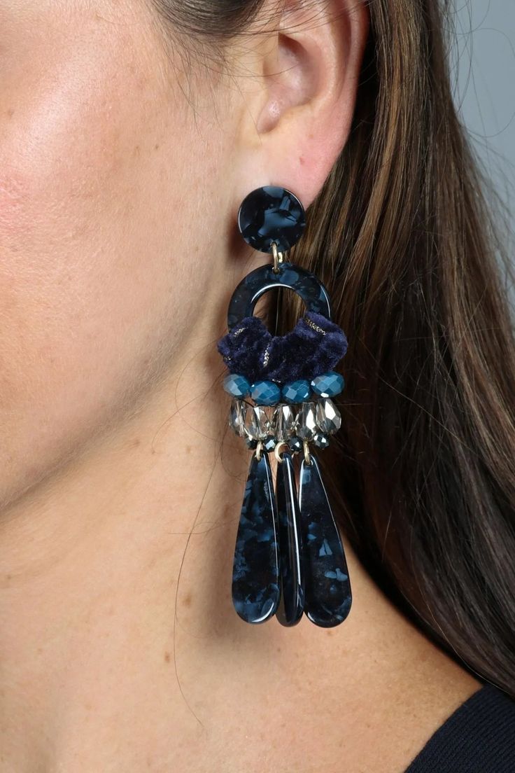 Featuring tortoise resin, velvet, and beads, these earrings are not for wallflowers. Our head-turning Lavish Velvet Earring adds elegance and glamour to event-ready ensembles. Materials: Resin, Glass Beads, Brass Size: 4" x 1.5" Stud Backing Imported Chic Resin Jewelry For Party, Elegant Blue Resin Earrings, Crystal Dangle Earrings, Midnight Blue, Tortoise, Ear Cuff, Glass Beads, Dangle Earrings, Size 4