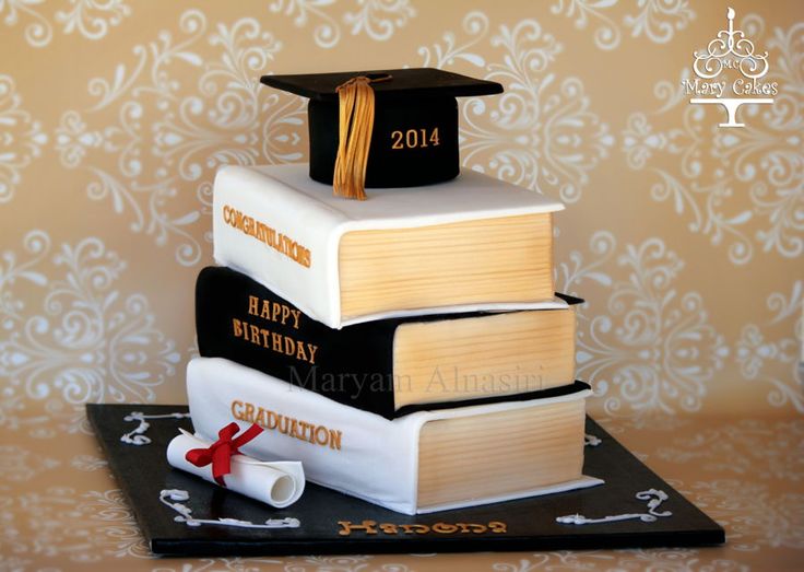 a graduation cake made to look like books