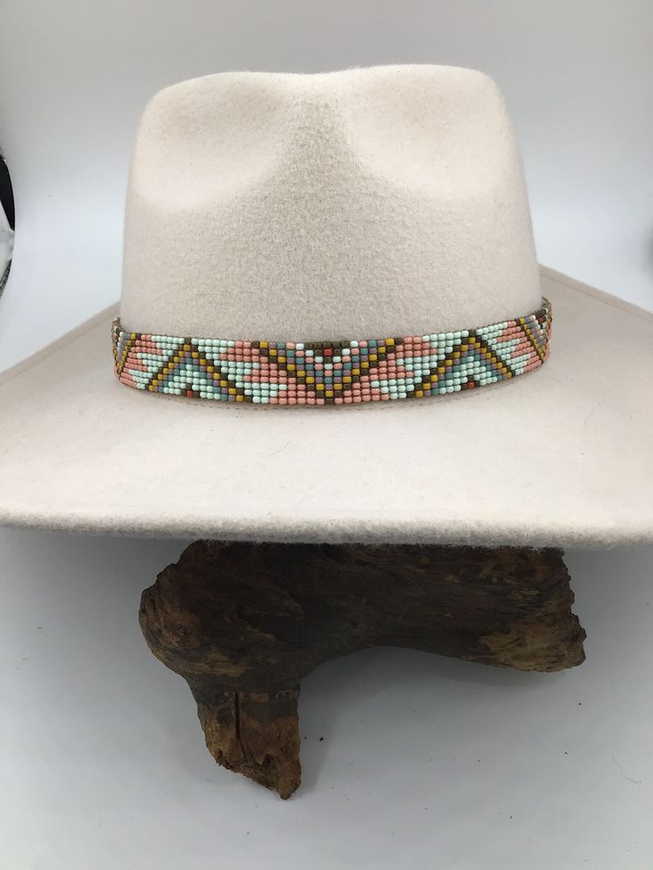 Leather Bead Hatband - Handcrafted by me in Wann, Oklahoma - Size 8/0 Beads are loomed (Chalk Green, Bronze, Mustard, Mauve, Turquoise Blue, and Terra Cotta) - Leather Ends are sewn and glued for added strength - Ties are 2mm Natural Leather - Width is 7/8" - Length is customized to your specification (Pictured is 23" Length) - Hats are for display purpose only.  NOTE:  Please state the length you need when placing your order!   If length not stated I will make the hatband to fit a 23" circumfer Adjustable White Southwestern Hat, White Southwestern Adjustable Hat, Southwestern White Adjustable Hat, Cream Bohemian Adjustable Hat, White Bohemian Woven Hat, Handmade Western Cream Hat Band, Handmade Cream Western Hat Bands, Cream Handmade Western Hat Bands, White Southwestern Fedora Hat Bands