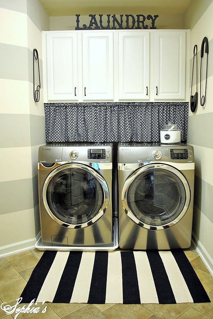 the laundry room is clean and ready to be used as a washer and dryer