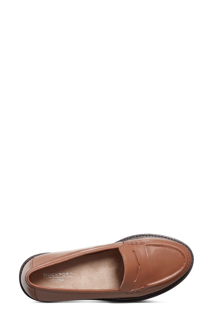 A timeless penny loafer shaped from soft leather is built with Trutech cushioning that absorbs shock and reduces leg fatigue for desk-to-dinner comfort. 1 1/4" heel Leather upper/textile lining/rubber sole Imported Classic Slip-on Platform Loafers For Office, Classic Platform Loafers With Removable Insole For Office, Classic Cushioned Loafers For Workwear, Classic Synthetic Moccasins With Round Toe, Classic Cushioned Slip-ons For Office, Classic Office Loafers With Removable Insole, Classic Brown Platform Loafers For Work, Classic Slip-ons With Cushioned Footbed For Office, Classic Office Slip-ons With Cushioned Footbed