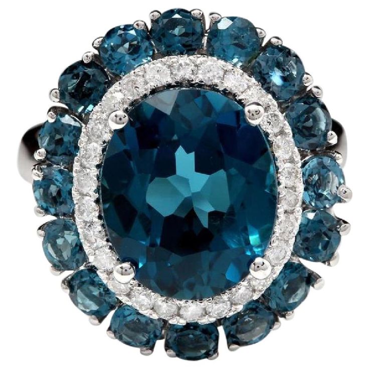 8.45 Carats Natural Impressive London Blue Topaz and Diamond 14K White Gold Ring Total Natural London Blue Topaz Weight: Approx. 8.00 Carats Center Topaz Weight is Approx. 7.00 Carats Center London Blue Topaz Measures: Approx. 12.00 x 10.00mm Natural Round Diamonds Weight: Approx. 0.45 Carats (color G-H / Clarity SI1-SI2) Ring size: 7 (we offer free re-sizing upon request) Ring total weight: Approx. 6.7 grams Disclaimer: all weights, measurements and colors are approximate and may vary slightly Emerald Cut Aquamarine Ring, Emerald Cut Rings, Gold Cocktail Ring, Blue Sparkles, Pink Topaz, 14k White Gold Ring, Pretty Rings, White Gold Ring, London Blue Topaz