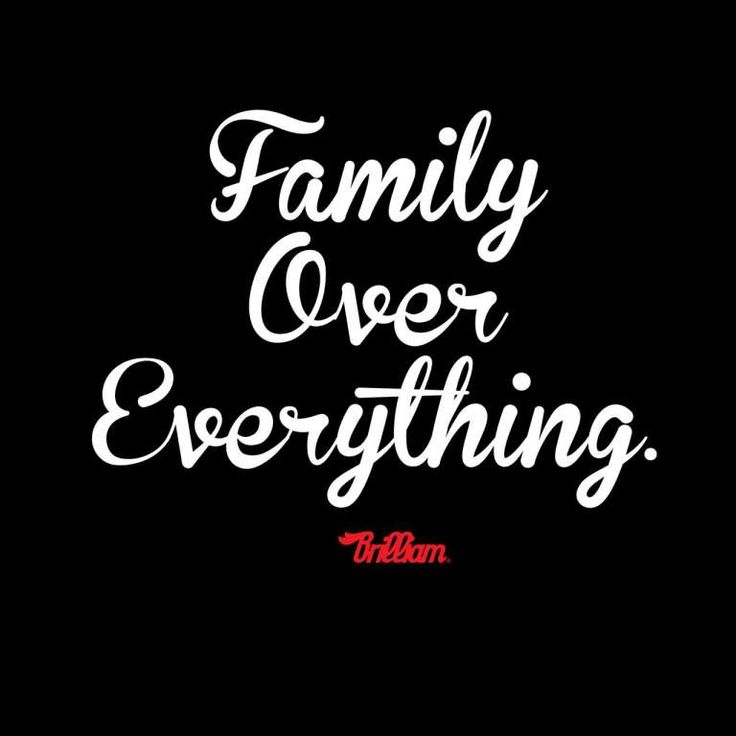 the words family over everything are written in white ink on a black background with red lettering