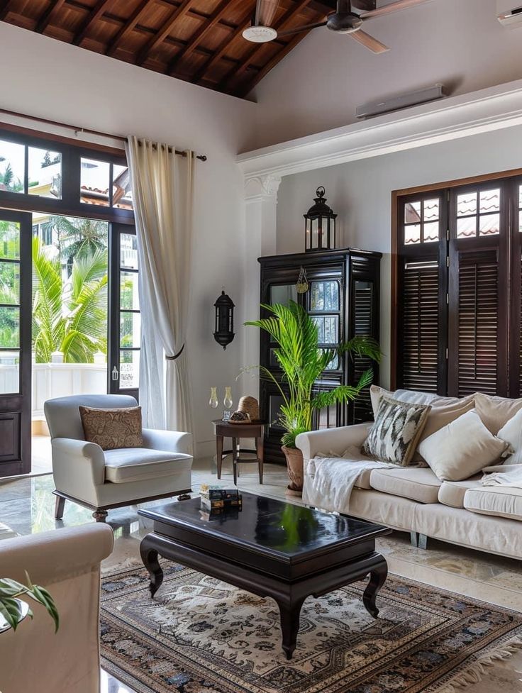 a living room filled with furniture and lots of windows