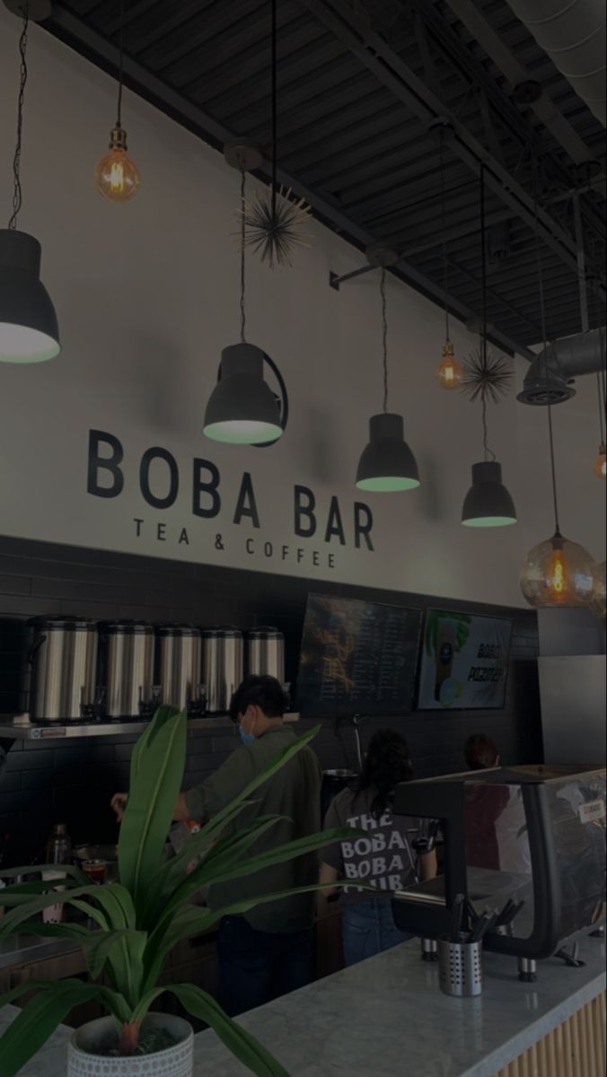 the interior of boba bar tea and coffee with plants in pots on the counter