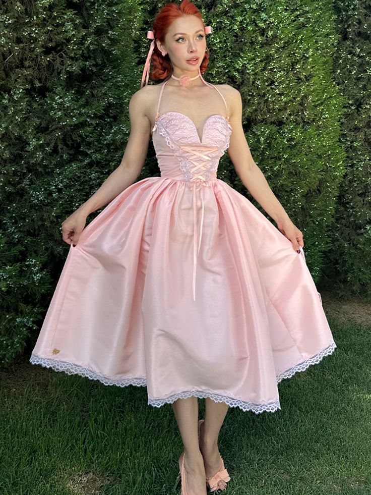 This enchanting dress features a delicate and flattering shade of pink with a pearl-like sheen. The bodice is structured with built-in boning to create a stunning, three-dimensional bust shape. Below the bust, the adjustable sash not only serves as a decorative element but also allows for a customizable fit around the waist. The voluminous skirt is adorned with an entire circle of lace trim, adding a touch of vintage charm while imparting a youthful look. Embrace the timeless elegance of Lolita Spring A-line Corset Dress With Fitted Bodice, Pink Fitted Corset Dress For Prom, Princess Style Dress With Sweetheart Neckline And Boned Bodice, Spring Formal Fitted Corset Dress, Princess Dress With Boned Bodice And Sweetheart Neckline, Princess Dress With Sweetheart Neckline And Boned Bodice, Spring A-line Corset Dress With Corset Back, Princess Style Satin Dress With Fitted Bodice, Pink Strapless Corset Dress For Summer