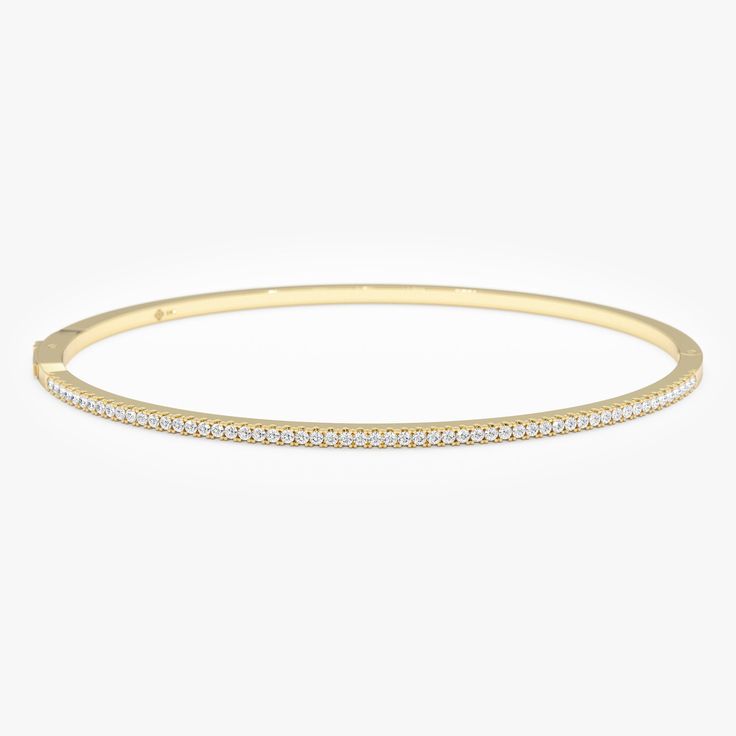 Discover understated luxury with this dainty 14k solid gold diamond bangle bracelet.  Its minimalist design features shimmering genuine diamonds, adding a touch of timeless elegance to your everyday style. Handcrafted with precision, this is a luxurious piece you'll treasure. Handmade  Solid Gold Natural Diamonds Diamond Ct weight 0.42 Bracelet Width 1.6mm Bracelet Height 2.1 mm 🛠 Your Sarah Elise piece is handcrafted with care! Ready-to-ship items go out within 3 business days. Made-to-order pieces typically take 7-10 business days to create. If you need something sooner, please contact us - we'll see if we can make it happen! For estimated shipping dates and tracking, check your Etsy account under 'Orders'. 🚐Orders under $100 are sent with USPS First Class Mail tracking; orders more th Minimalist Gold Cubic Zirconia Bangle Bracelet, Minimalist 14k Gold Bracelet With Diamond Accents, Minimalist White Gold Bangle For Everyday Luxury, Minimalist Bangle With Diamond Accents And Cubic Zirconia, Minimalist Stackable White Gold Diamond Bracelet, Minimalist Brilliant Cut Bangle For Formal Occasions, Minimalist White Gold Stackable Diamond Bracelet, Minimalist White Gold Bangle With Single Cut Diamonds, Minimalist White Gold Bangle With Diamond Accents