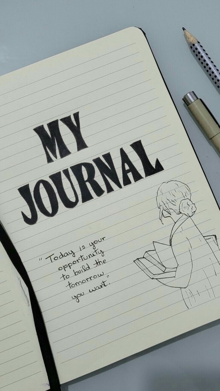 an open notebook with the words my journal written on it next to a pen and pencil