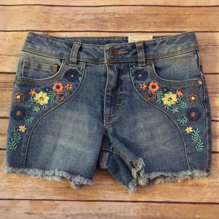 Blue Denim Shorts With Embroidered Flowers On Front. Nwt Embroidered Denim Blue Jean Shorts, Embroidered Medium Wash Denim Jean Shorts, Medium Wash Cotton Jean Shorts With Floral Embroidery, Embroidered Medium Wash Denim Shorts, Embroidered Denim Jean Shorts In Blue, Embroidered Medium Wash Cotton Jean Shorts, Cotton Jean Shorts With Floral Embroidery In Medium Wash, Embroidered Cotton Jean Shorts In Medium Wash, Embroidered Denim Blue Cotton Jean Shorts