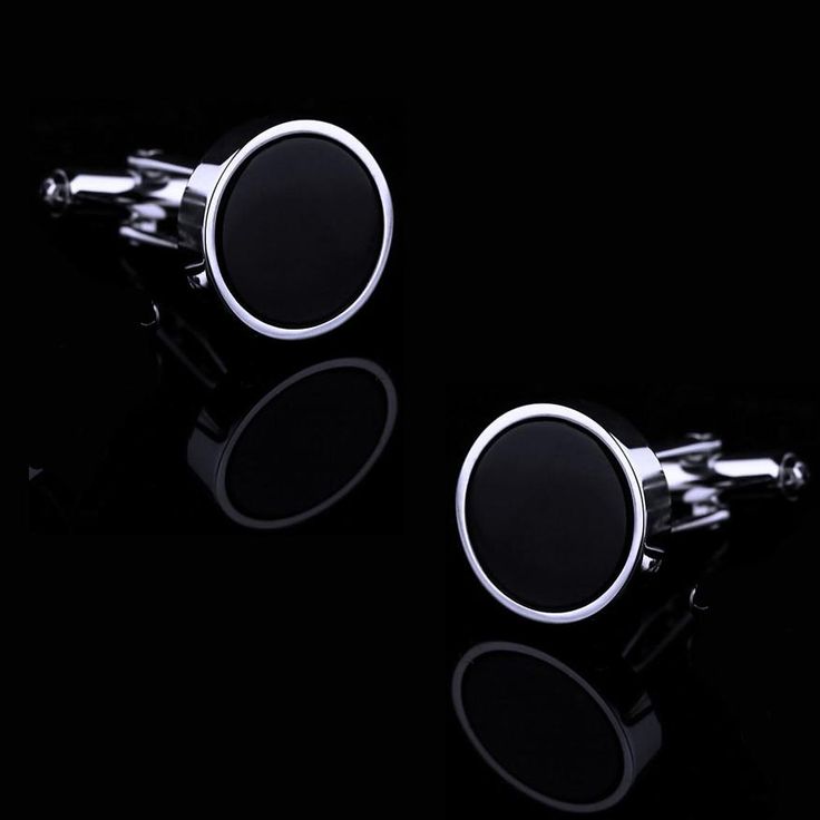 If you want to opt for an understated look, yet draw the right attention, these classic black round cufflinks are your best bet. You are already aware of the importance of choosing the right accessories, so this pair will definitely elevate your appearance in a dignified manner. The black oval disc surrounded by silver plating serves as the centerpiece. The finishing isn’t overly shiny – it is deliberately polished in a muted style with a distinct vintage patina coating the silver hardware. Of c Elegant Black Cufflinks For Business, Adjustable Black Cufflinks For Business, Classic Silver Cufflinks For Black Tie Events, Classic Black Business Cufflinks, Black Cuff Jewelry For Business, Modern Black Cufflinks For Business, Classic Black Cufflinks For Formal Occasions, Classic Black Formal Cufflinks, Elegant Black Jewelry For Office