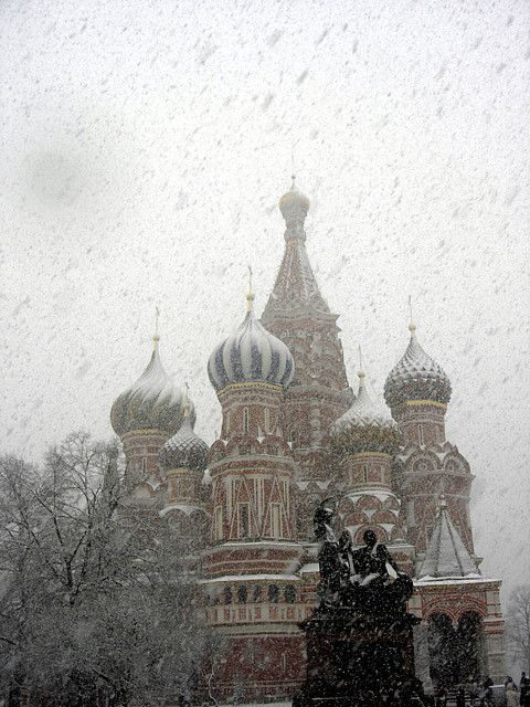 the cathedral is covered in snow as it stands tall