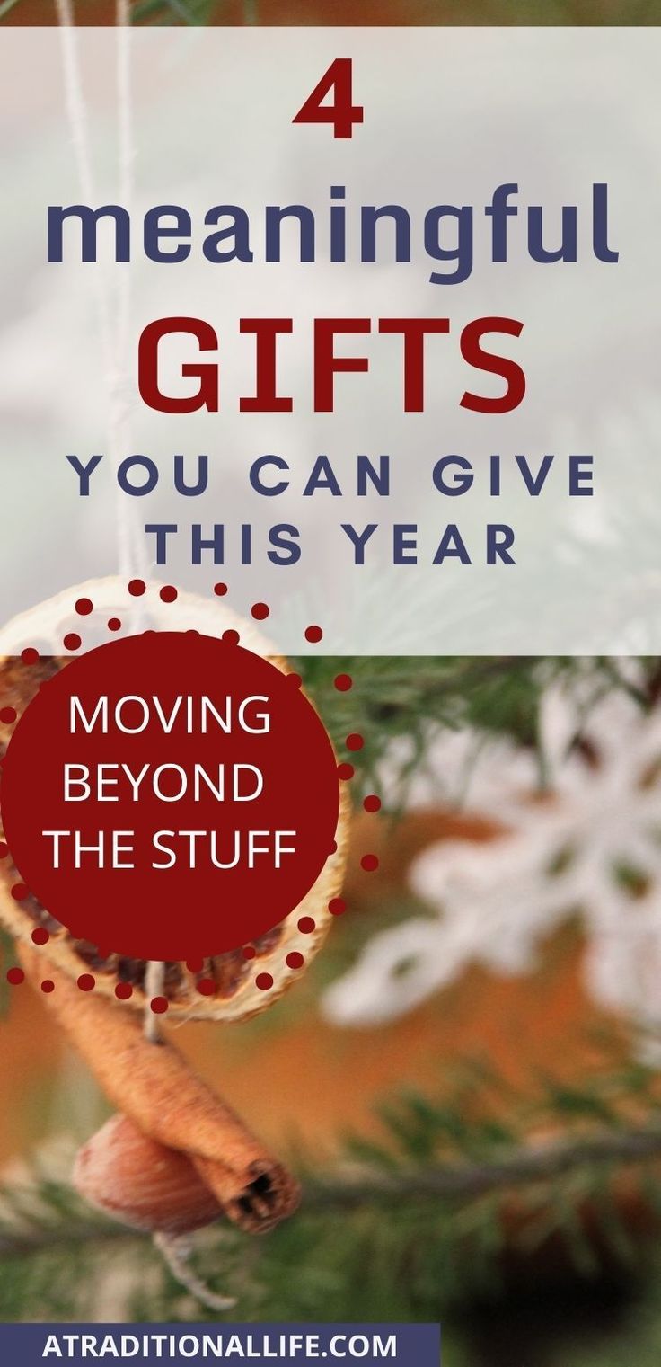 an ornament hanging from a christmas tree with the words, 4 meaningful gifts you can give this year moving beyond the stuff