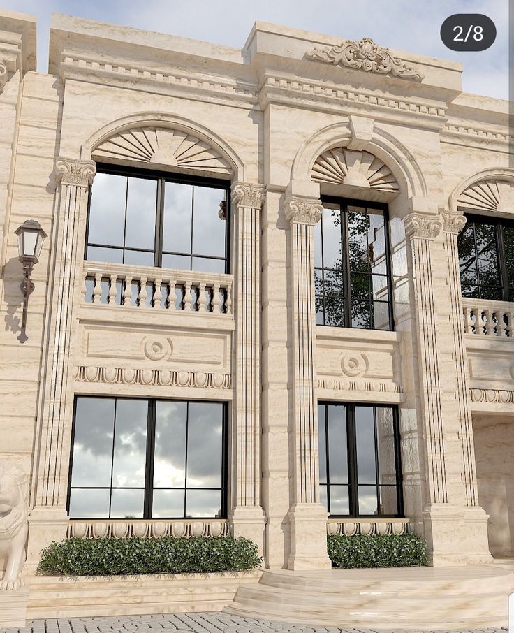 a large white building with many windows and balconies