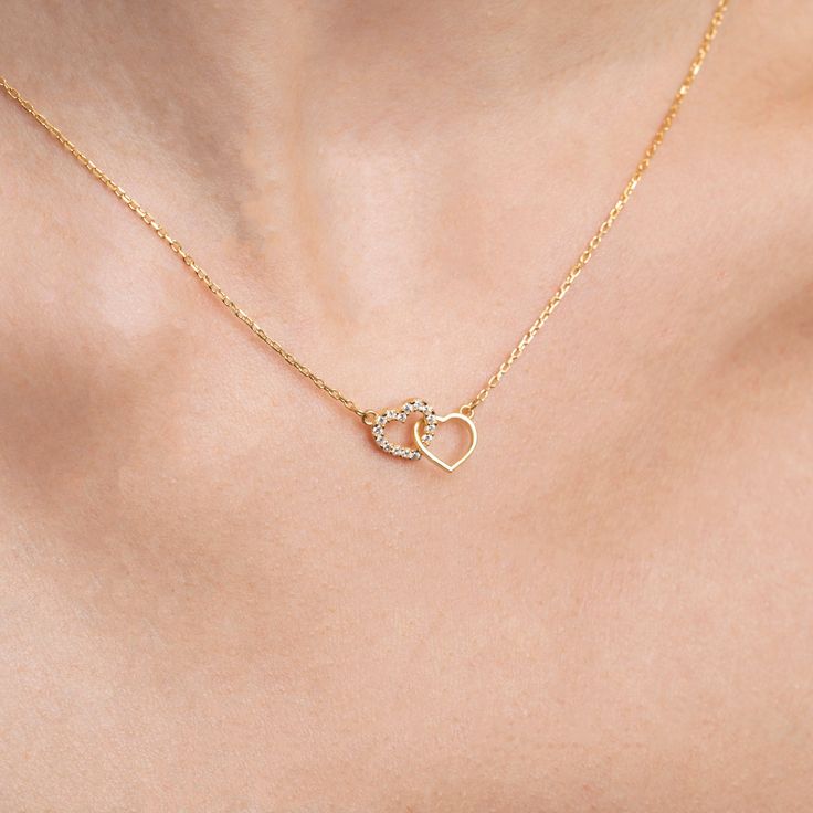 "Introducing the 14K Solid Gold Double Heart Necklace, sure to add a spark of love and elegance to any ensemble. This chic, dainty necklace is inspired by the heart and crafted with the utmost care and attention to detail. Our beautiful 14K Solid Gold Double Heart Necklace is the perfect piece to make you feel extra special. Available in 14K, 10K, and 8K Solid Gold, as well as in 925 Sterling Silver, this stunning handmade jewelry makes a wonderful gift for someone special. With its two double h Two Heart Necklace, Heart Pendent, Aesthetic Necklace, Jewellery Business, Double Heart Necklace, Jewelry Heart, Girly Accessories, Classy Jewelry, Pretty Necklaces