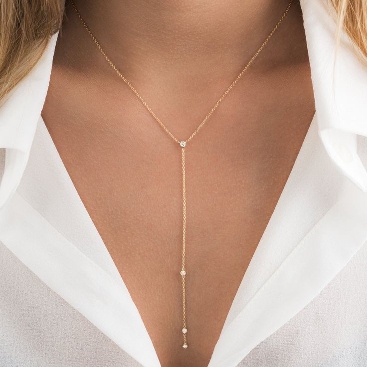 Our Selena lariat necklace is the perfect accessory! You can choose between 2 necklace lengths: 16" and 18" inch. This necklace is made of solid 14k gold and has 4 diamonds with the center diamond being .07 carats and the drop diamonds being .06 carats. We offer this piece in Yellow and white Gold. Layer this beautiful and delicate diamond lariat necklace or show it off on its own. ✨ Features ✨ • Ready To Ship. • Made in the USA.• Gold : Solid 14K• Choice of Gold: Yellow Gold, White Gold• Gem St Diamond Lariat Necklace, Lariat Style Necklace, Gold Lariat Necklace, 2 Necklace, Jewel Wedding, Diamond Jewelry Designs, Solid Gold Jewelry, Lariat Necklace, Rose Gold Necklace