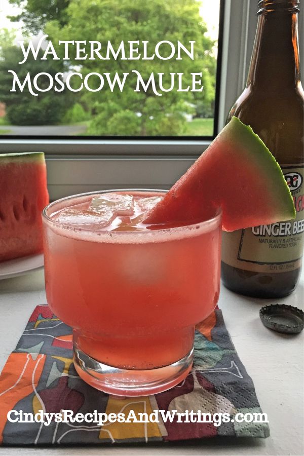 watermelon moscow mule in front of a window