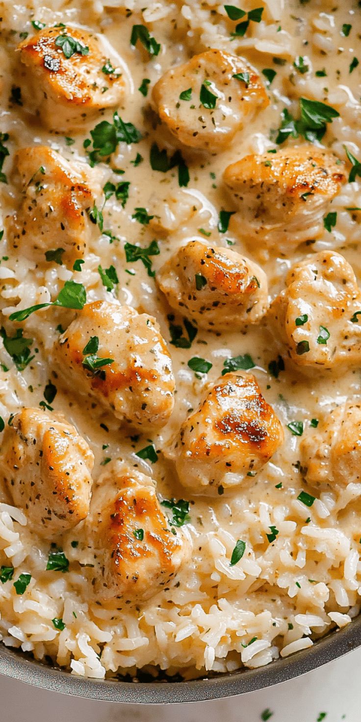 chicken and rice in a skillet with parsley on top, ready to be eaten