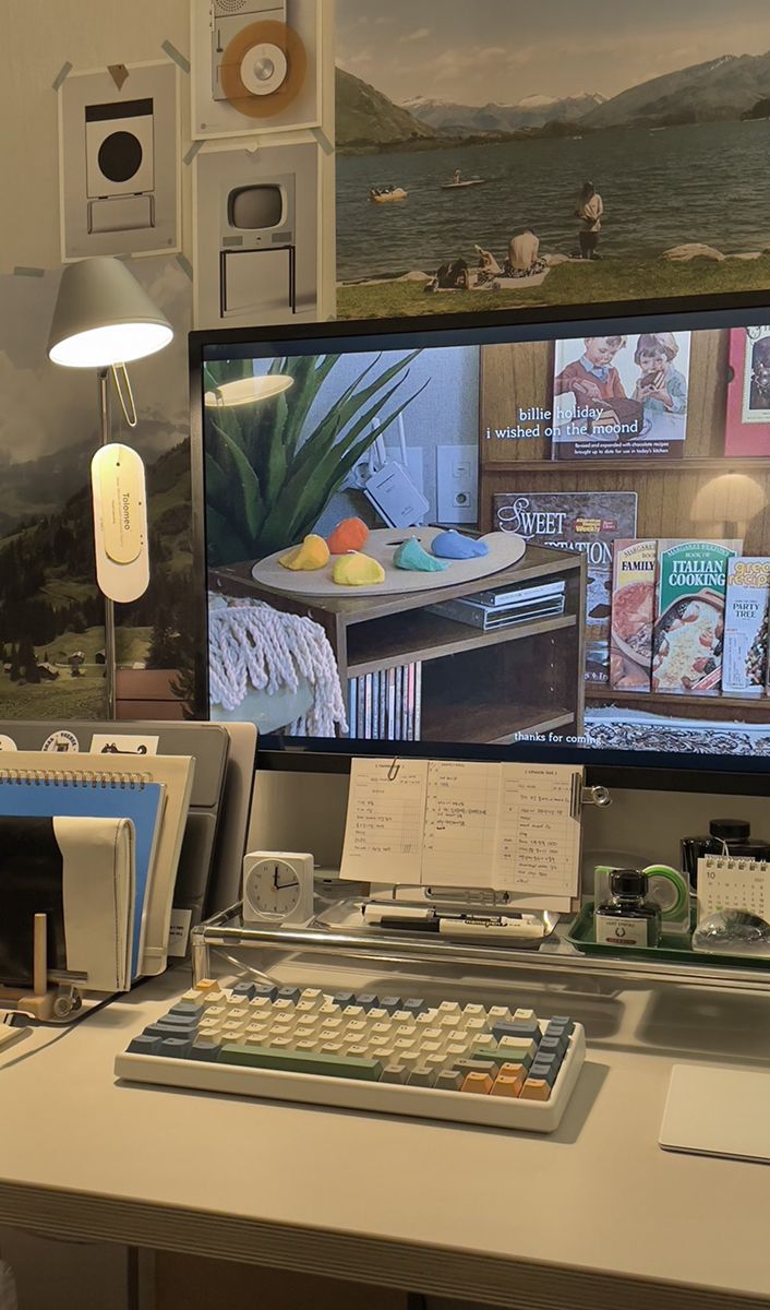 a desk with a keyboard and monitor on it