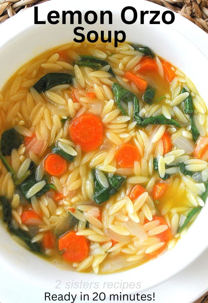 a bowl of lemon orzo soup with carrots and spinach