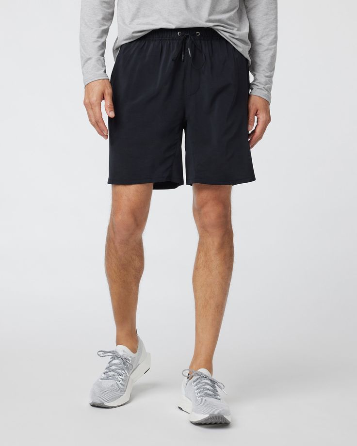 Unlock more momentum with this upgraded version of our classic Kore Short—featuring new zip pockets that keep your essentials safe and secure, plus a new performance fabric with black trims. Go commando in confidence with the breathable, boxer-brief liner. | Vuori Elevate Kore Shorts | Black | XS Vuori makes premium performance apparel inspired by the active Coastal California lifestyle; an integration of fitness, surf, sport, and art. Breaking down the boundaries of traditional activewear, we a Black Outdoor Activewear With Built-in Shorts, Functional Athletic Shorts With Elastic Waistband, Activewear With Side Pockets For Sports, Black Running Bottoms With 5-inch Inseam, Black Activewear With Built-in Shorts For Outdoor, Sporty Activewear With Side Pockets And 5-inch Inseam, Black Training Activewear With Functional Pockets, Black Activewear For Training With Functional Pockets, Black Activewear With Functional Pockets For Training