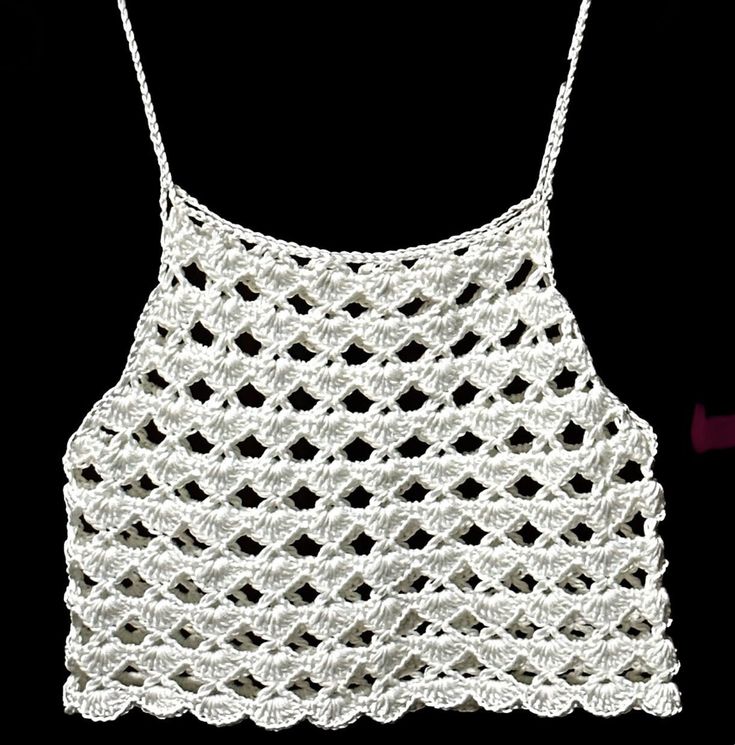 a white crocheted top with the words, stylecrochets written on it