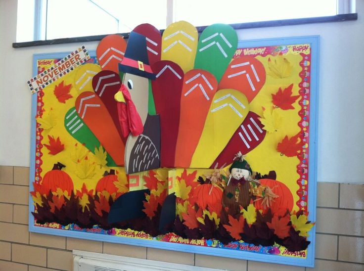 a bulletin board decorated with turkeys and fall leaves