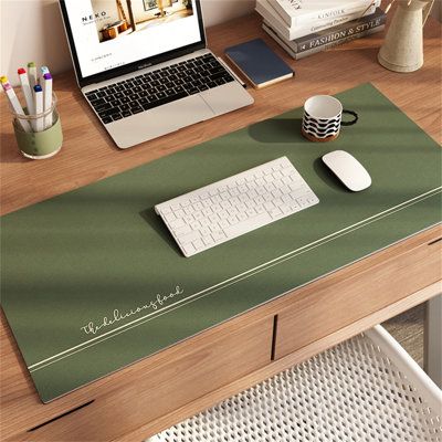 a laptop computer sitting on top of a wooden desk next to a mouse and keyboard