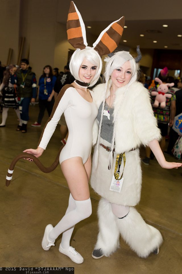 two women in bunny costumes posing for the camera