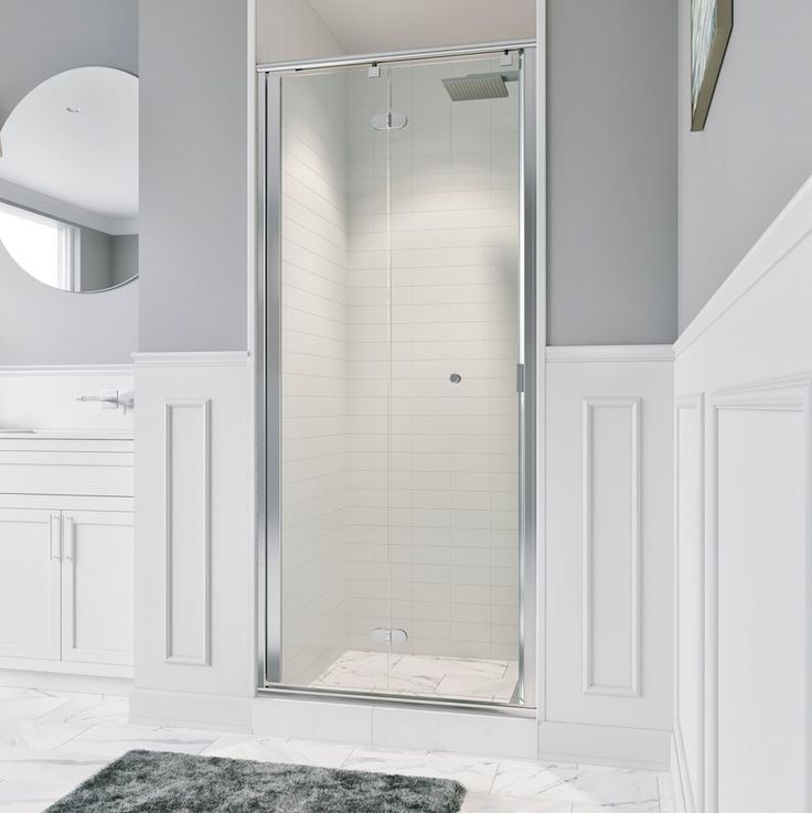 a white bathroom with a walk in shower