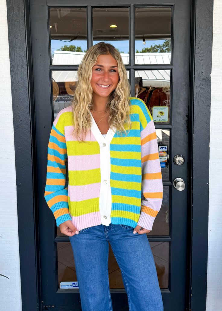 Indulge in comfort with the Flavia Sweater. Made from a luxurious cashmere-blend, this cozy drop-shoulder sweater offers a soft touch and relaxed fit. The mixed stripes add a touch of style, while the deep V-neck and front button closure make it versatile. Stay warm and stylish with the Flavia cardigan. Lilli is wearing a size Small. Height is 5’3, Bust is 32”, Waist 26”, and Hips 33”. Spring Striped Soft Knit Sweater, Striped Sweater For Spring Layering, Striped Sweater For Everyday In Fall, Striped Sweater For Fall Loungewear, Striped Oversized Cardigan For Spring, Oversized Striped Cardigan For Spring, Cozy Striped Cardigan For Spring, Cozy Striped Spring Cardigan, Casual Sweater With Vertical Stripes For Fall