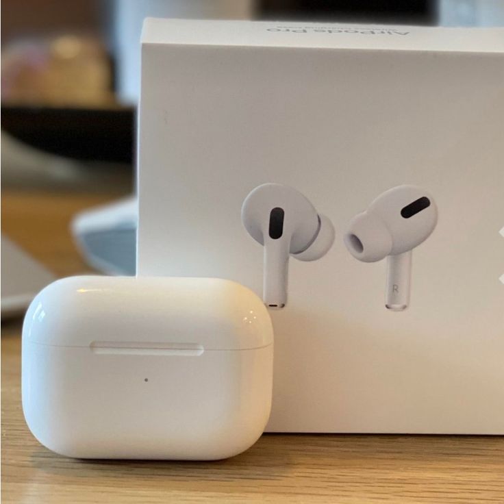 an apple airpods sitting on top of a white box