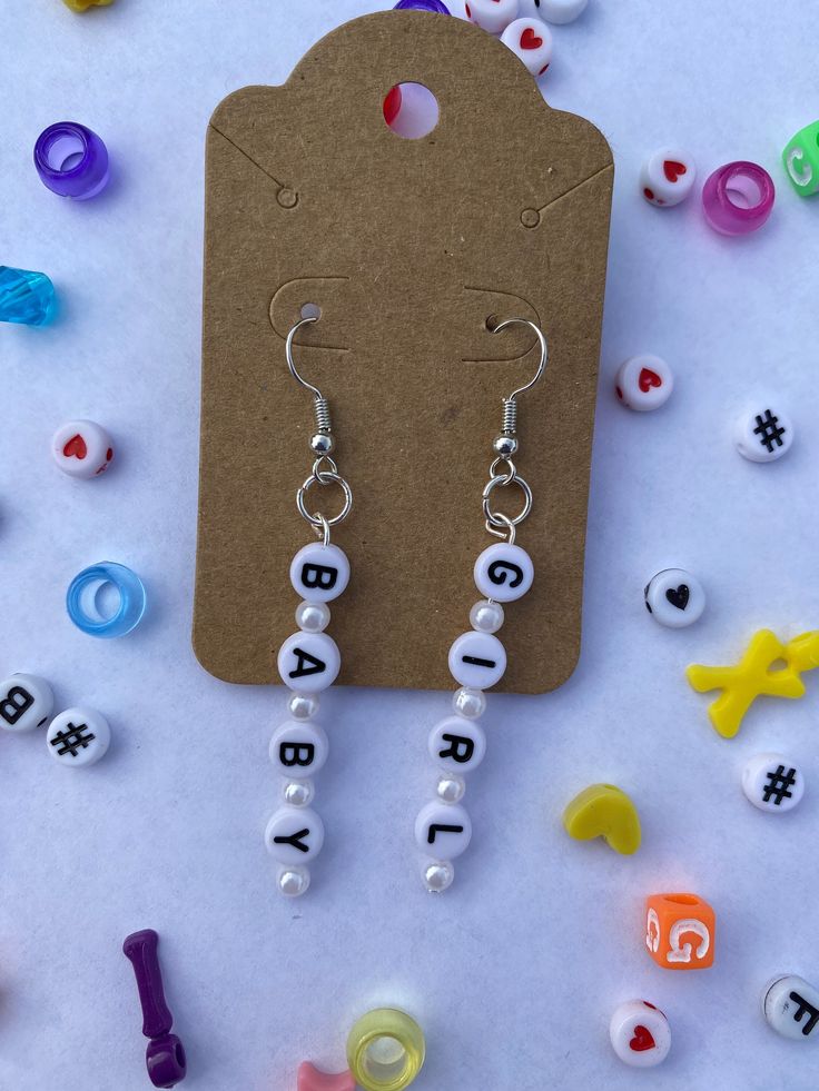 "Baby girl" beaded earrings! Cheap Cute Beaded Earrings For Gifts, Cheap Fun Beaded Earrings For Gifts, Fun Beaded Earrings For Gifts, Nickel-free Beaded Glass Earrings As Gift, Plastic Baby Earrings, Marble Crafts, Safety Pin Jewelry Patterns, Marbles Crafts, Pop Jewelry