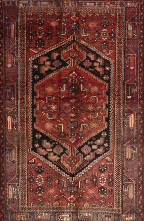 an antique persian rug with red and black colors