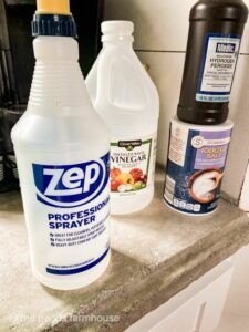 several cleaning products are sitting on the counter