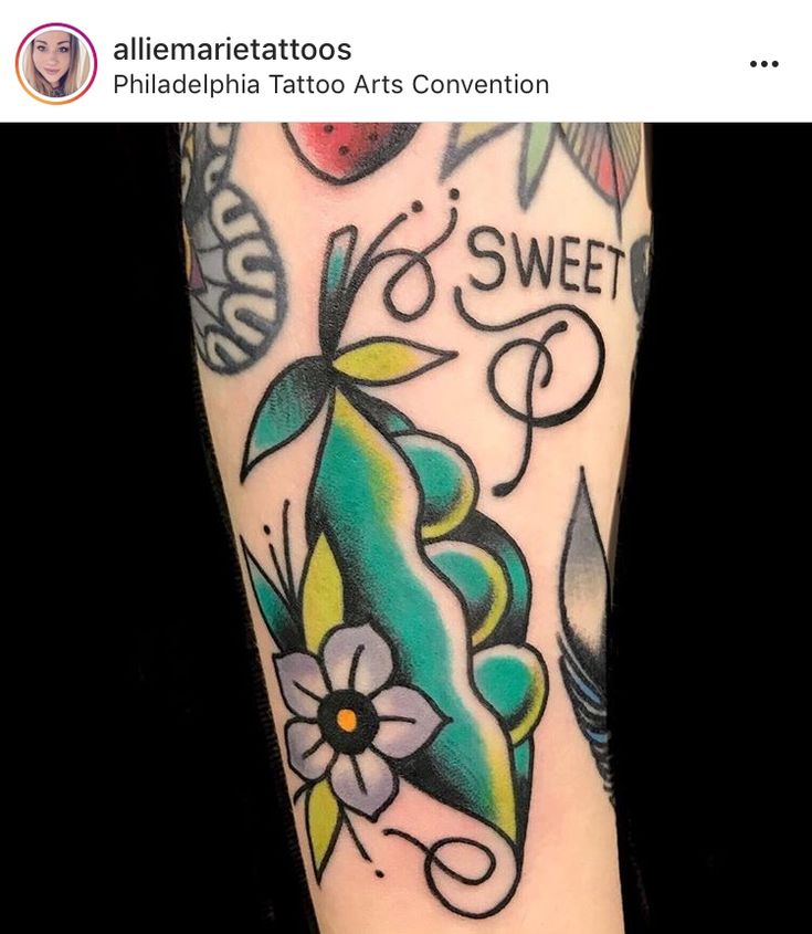 an arm with tattoos on it that says sweet and has flowers in the center,