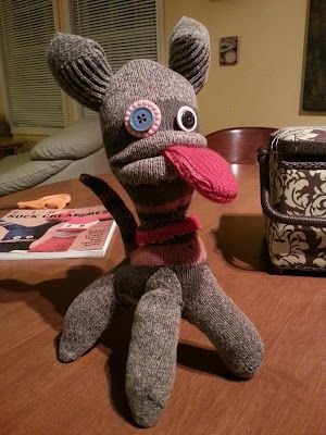 a stuffed animal is sitting on a table