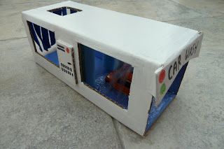 an open white box sitting on the ground