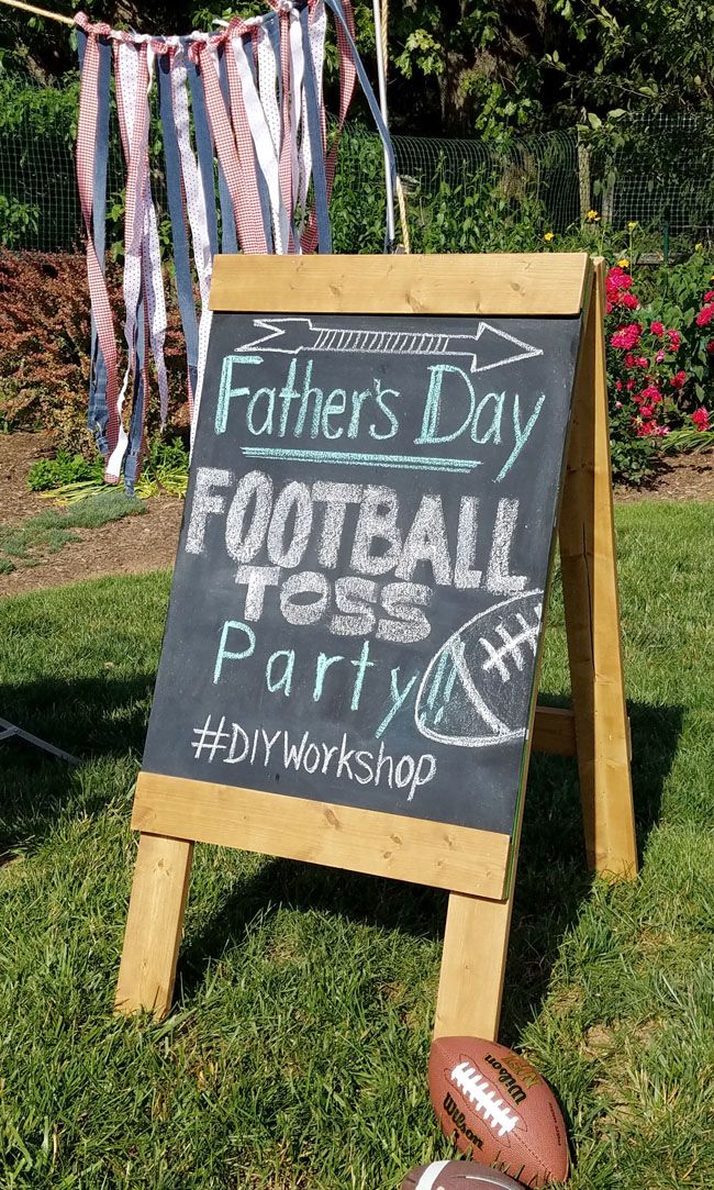 a chalkboard sign that says father's day football party