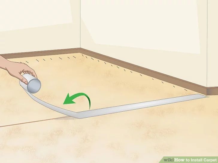 a person is using a mouse to clean the floor in their house with a spray bottle