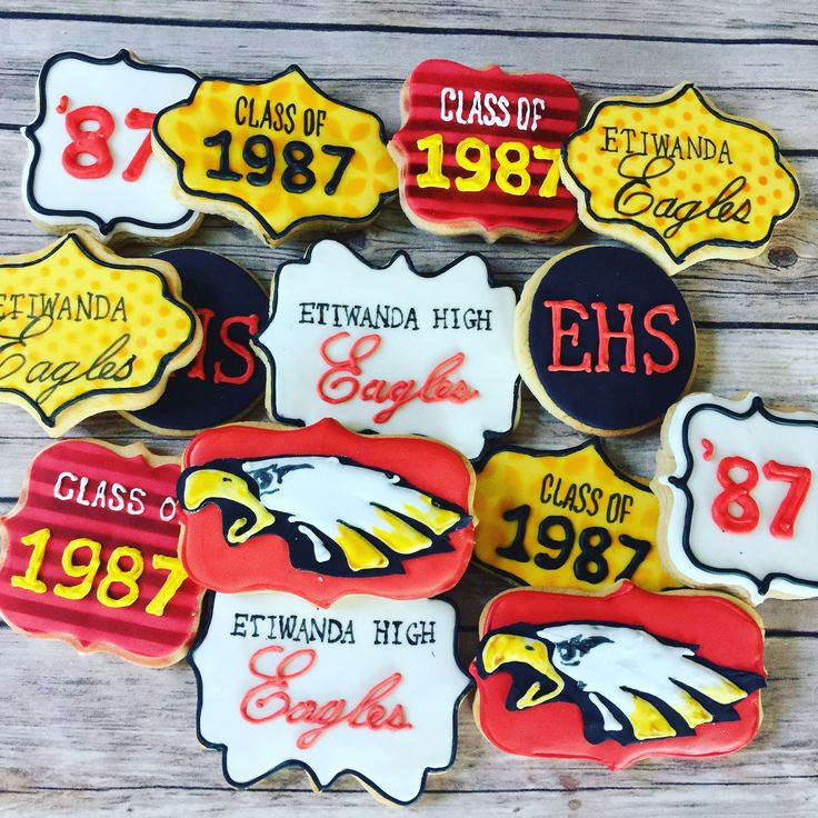 decorated cookies are arranged in the shape of eagles and their name, class of 1971