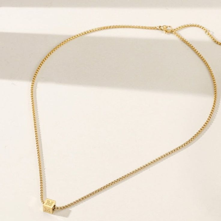 Durable and stylish, our waterproof necklace is crafted for both functionality and fashion. Perfect for any occasion, it's the ideal accessory for those who appreciate durability and timeless elegance. Perfect for the minimalist and a beautiful piece to layer with. A true versatile statement piece that you can wear straight from the pool to dinner! - 18K gold plated / stainless steel - Waterproof technology - 18" in length - Necklace + 1 cube (initial or sign) = $45 - Additional cubes with lette Minimalist Box Chain Choker, Everyday Jewelry Choker With Box Chain, Everyday Jewelry Box Chain Choker, Adjustable Rectangular Chain Necklace, Minimalist Metal Clavicle Chain Charm Necklace, Minimalist Adjustable Chain Necklace, Everyday Long Box Chain Necklace, Minimalist Long Charm Necklaces, Simple Pendant Charm Necklace With Adjustable Chain