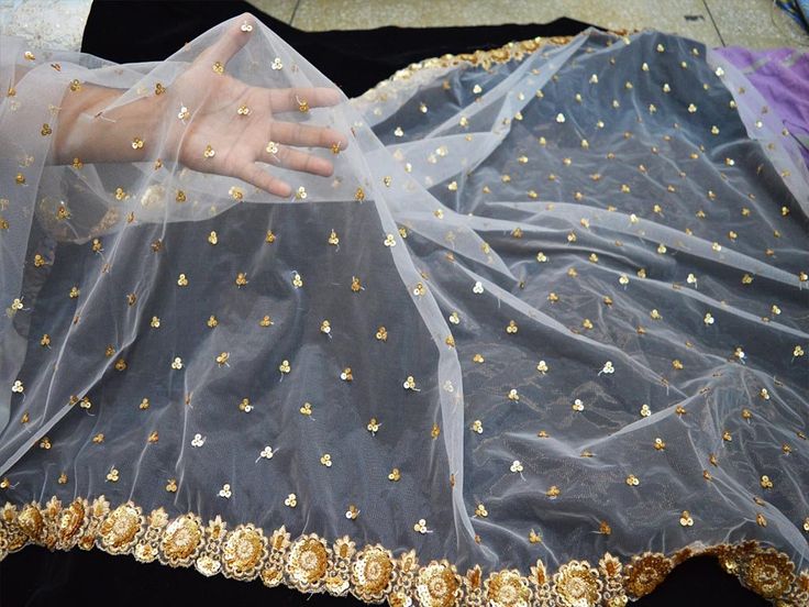 2.5 Yards White Net Gold Embroidered Fabric, Embroidered Floral Fabric, Dyeable  ➤ Color : White and Gold (Dyeable) ➤ Width : 39 Inches ➤ Fabric : Net ➤ Code-emb55 ➤ Listing for 2.5 Yards of fabric.  Indian Wedding Dupatta Embroidered Net Long Dupatta Chuni Bridal Veil Sequins Lehenga Embroidery Stoles Festival Punjabi Dress Chunni, Party Wear Dupatta, Lehenga Skirt Wear Dupatta, Designer Dupatta, Women Wedding Stole, Ladies Wedding Dupatta, Embroidered Designer Dupatta, Wedding Stoles, Occasion Dress Fabric Stoles, Stunning Stoles. Beautiful Pink Embroidery Sequins Work In Floral Design Work Net Dupatta. The Dupatta Has Lovely Floral Embroidery Work Pattern All Over With Scalloped Border All The Four Sides. Gold embroidery work fabric. You can use this fabric to make dresses, tops, Crafti Tulle Saree, Sequins Lehenga, Dupioni Silk Fabric, Wedding Dress Crafts, Making Scarves, Bridal Dupatta, Robes D'occasion, Sewing Wedding Dress, Punjabi Dress