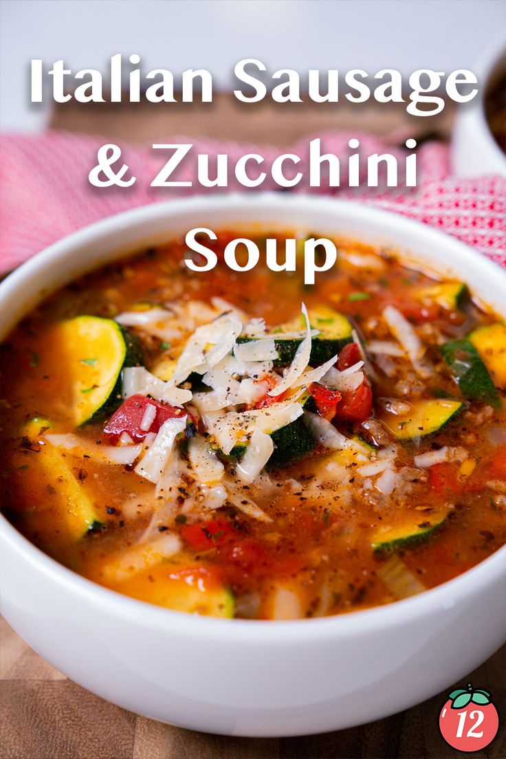 italian sausage and zucchini soup in a white bowl