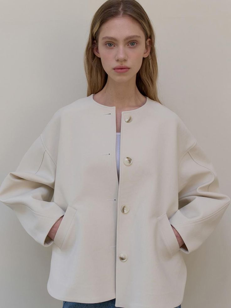 This is a clean and casual jacket by L’oiE that is made out of high quality and sturdy fabric. With unique design detail and trendy mood, you can style it for your refined and casual daily outfit.- Voluminous sleeves detail- Round neckline- Oversized shoulder line Modern Structured Beige Outerwear, Oversized Beige Modern Outerwear, Spring Modern Outerwear With Hidden Button Closure, Modern Spring Outerwear With Hidden Button Closure, Chic Cream Outerwear With Button Cuffs, Modern Cream Outerwear For Work, Chic Cream Outerwear With Hidden Button Closure, Elegant Everyday White Outerwear, Modern Structured Outerwear With Button Closure