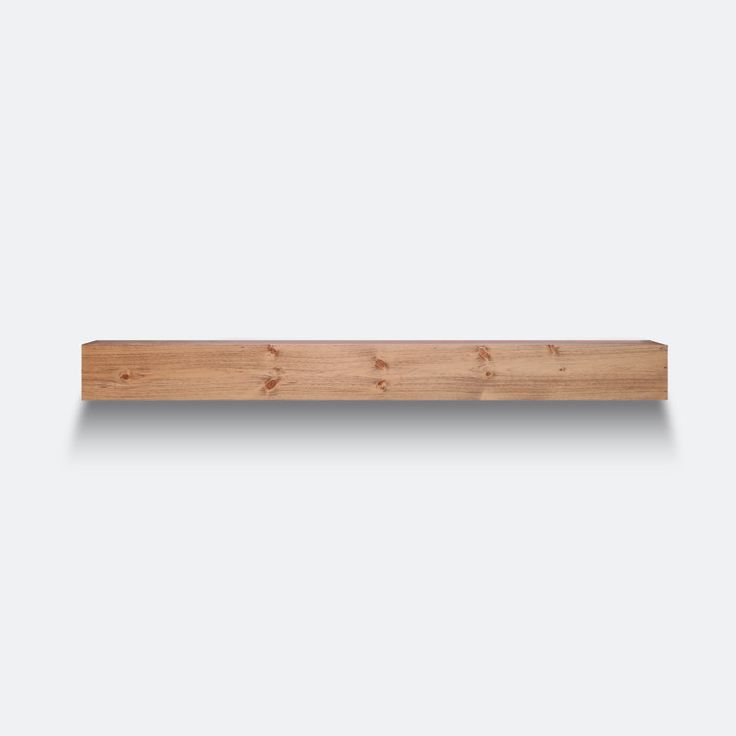 a wooden shelf with three small holes on the top and one in the middle, against a white background